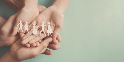 Hands holding diversity family, happy  volunteer, disable nursing home, rehabilitation and health insurance concept